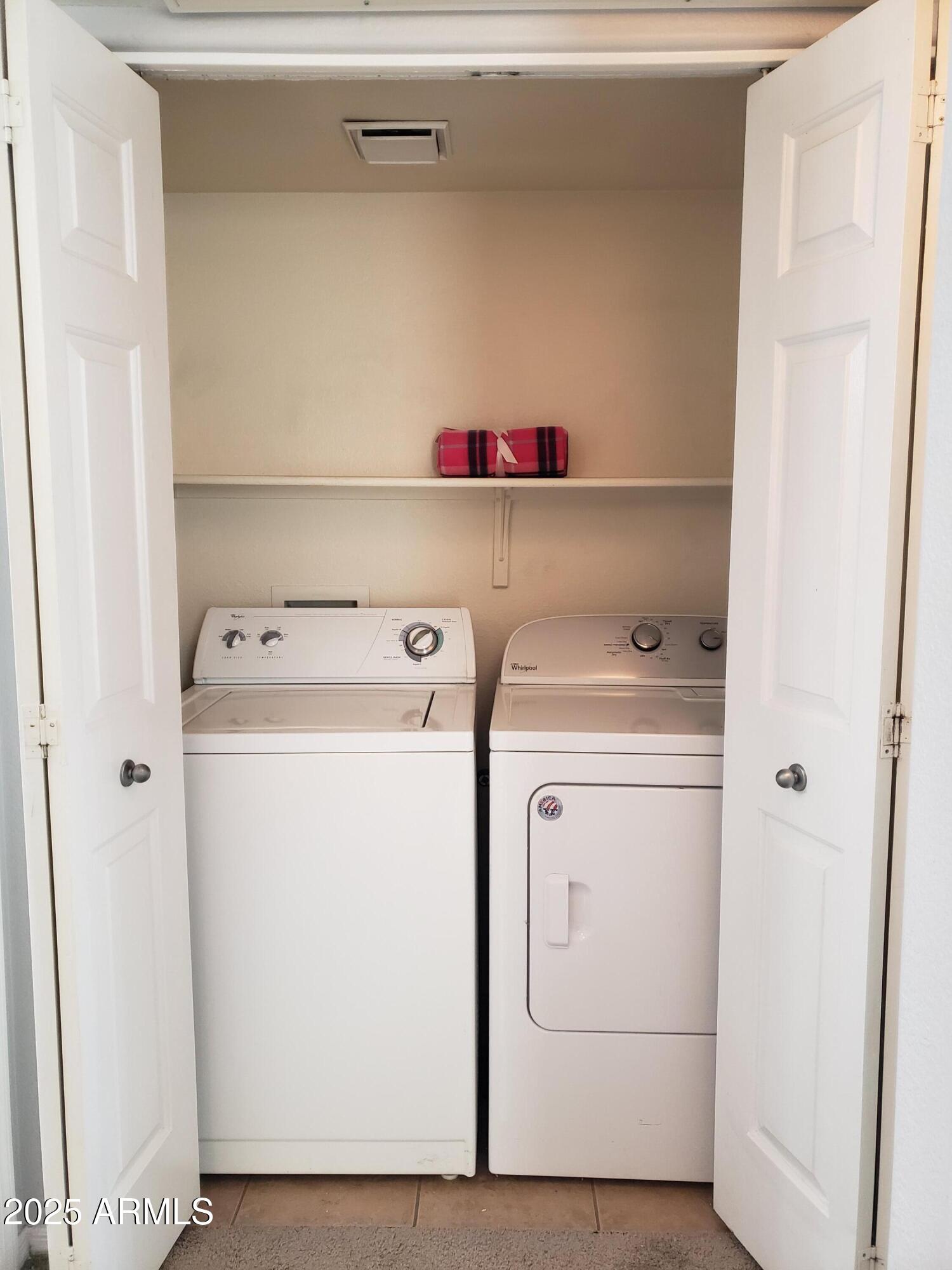 1825 West Ray Road, Unit 2031 Chandler, AZ 85224 - Photo 14 of 21 a utility room with dryer and washer