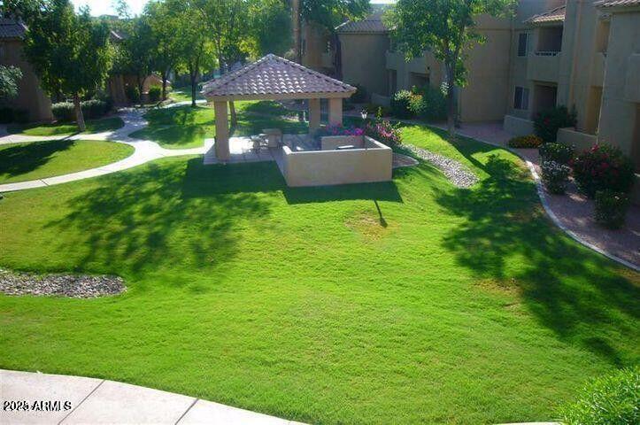 1825 West Ray Road, Unit 2031 Chandler, AZ 85224 - Photo 16 of 21 a view of a house with a yard