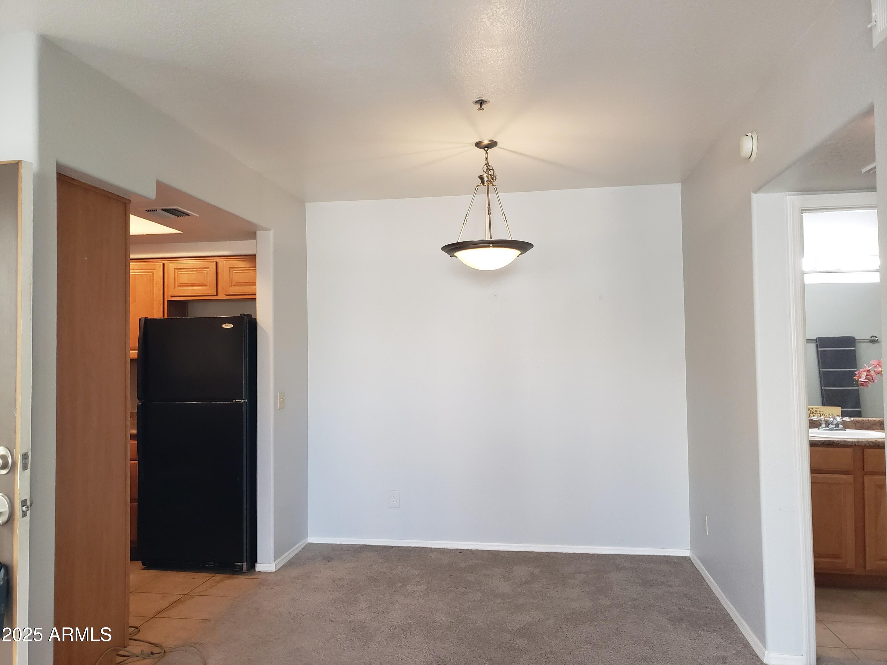1825 West Ray Road, Unit 2031 Chandler, AZ 85224 - Photo 4 of 21 a view of empty room with closet and entryway