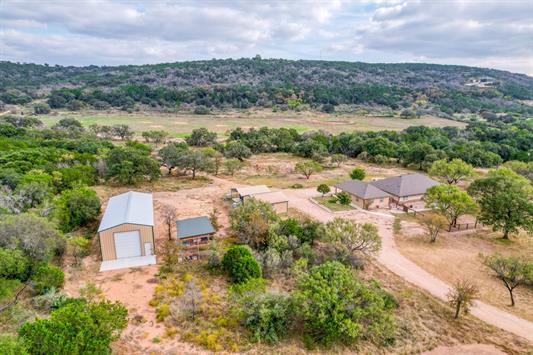 395 Lehne Loop Buchanan Dam, TX 78609 - Photo 1 of 27 an aerial view of a house with a yard and lake view