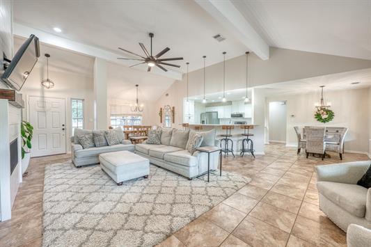 395 Lehne Loop Buchanan Dam, TX 78609 - Photo 14 of 27 a living room with furniture and a chandelier