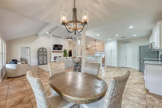 a dining room with furniture and window