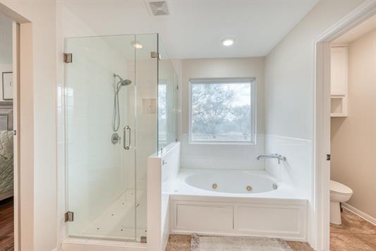 395 Lehne Loop Buchanan Dam, TX 78609 - Photo 19 of 27 a bathroom with a bathtub and a shower