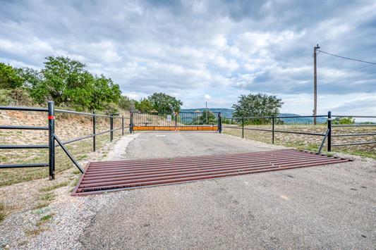 395 Lehne Loop Buchanan Dam, TX 78609 - Photo 26 of 27 a view of a tennis ground with large trees