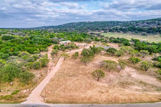 395 Lehne Loop Buchanan Dam, TX 78609 - Photo 3 of 27 a view of a yard with a garden