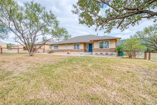 395 Lehne Loop Buchanan Dam, TX 78609 - Photo 4 of 27 a front view of a house with a yard
