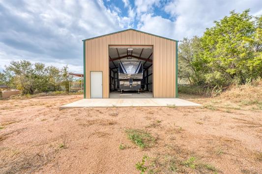 395 Lehne Loop Buchanan Dam, TX 78609 - Photo 10 of 27 a front view of a house with a yard