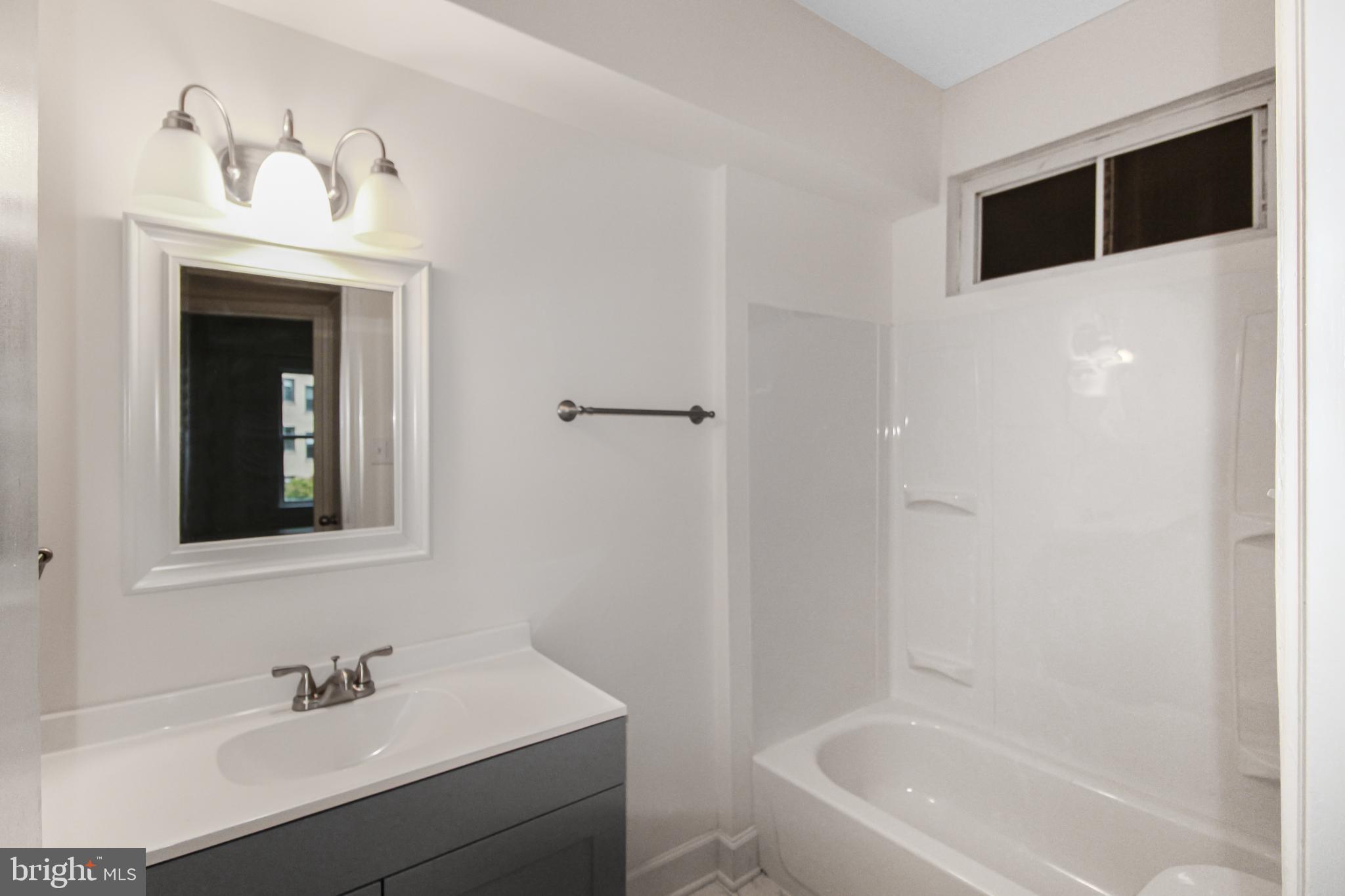 3901 Cathedral Avenue Northwest, Unit 201 Washington, DC 20016 - Photo 17 of 30 Modern bathroom with sleek finishes.