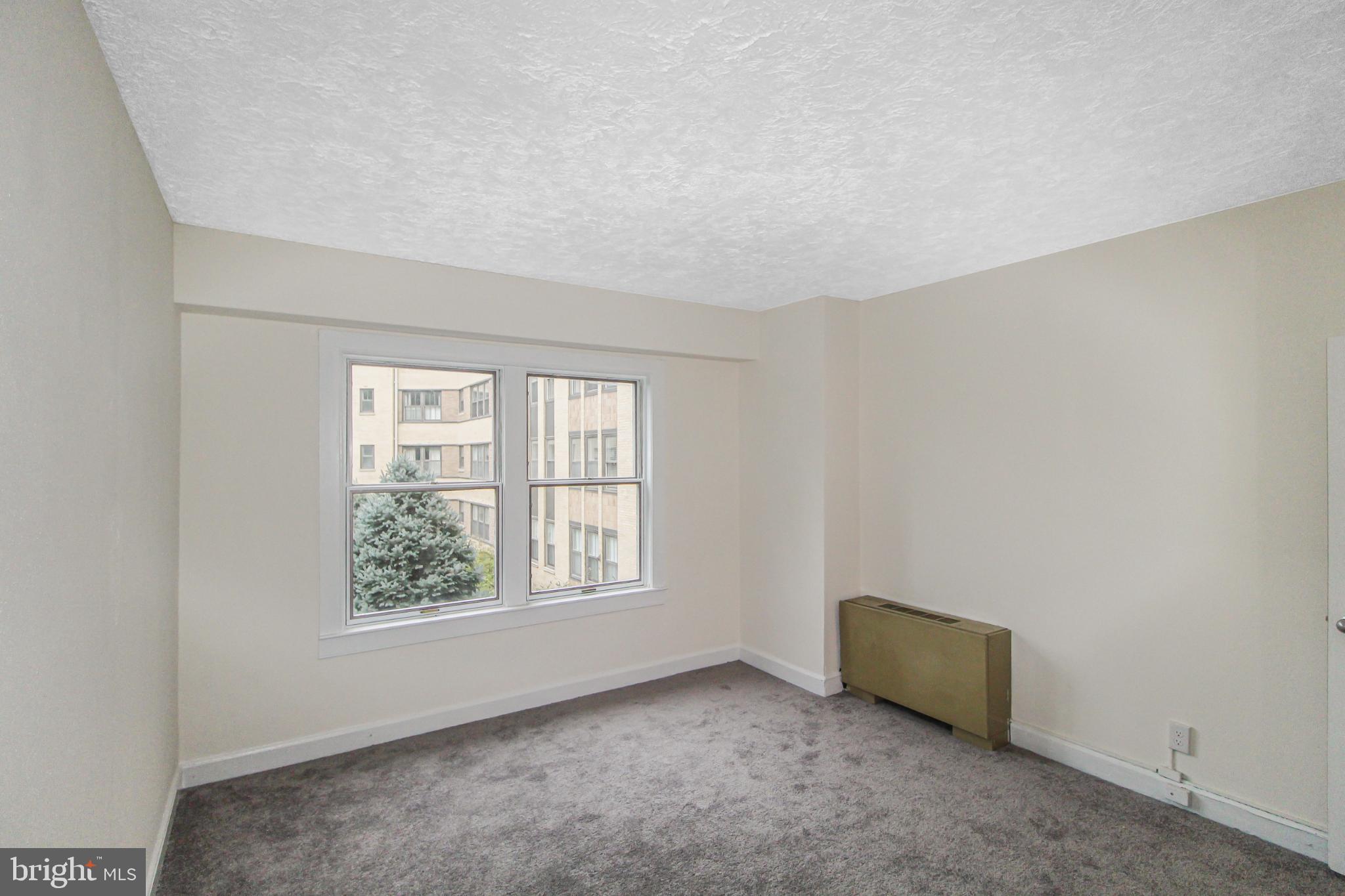 3901 Cathedral Avenue Northwest, Unit 201 Washington, DC 20016 - Photo 19 of 30 Bedroom with views of the Courtyard.