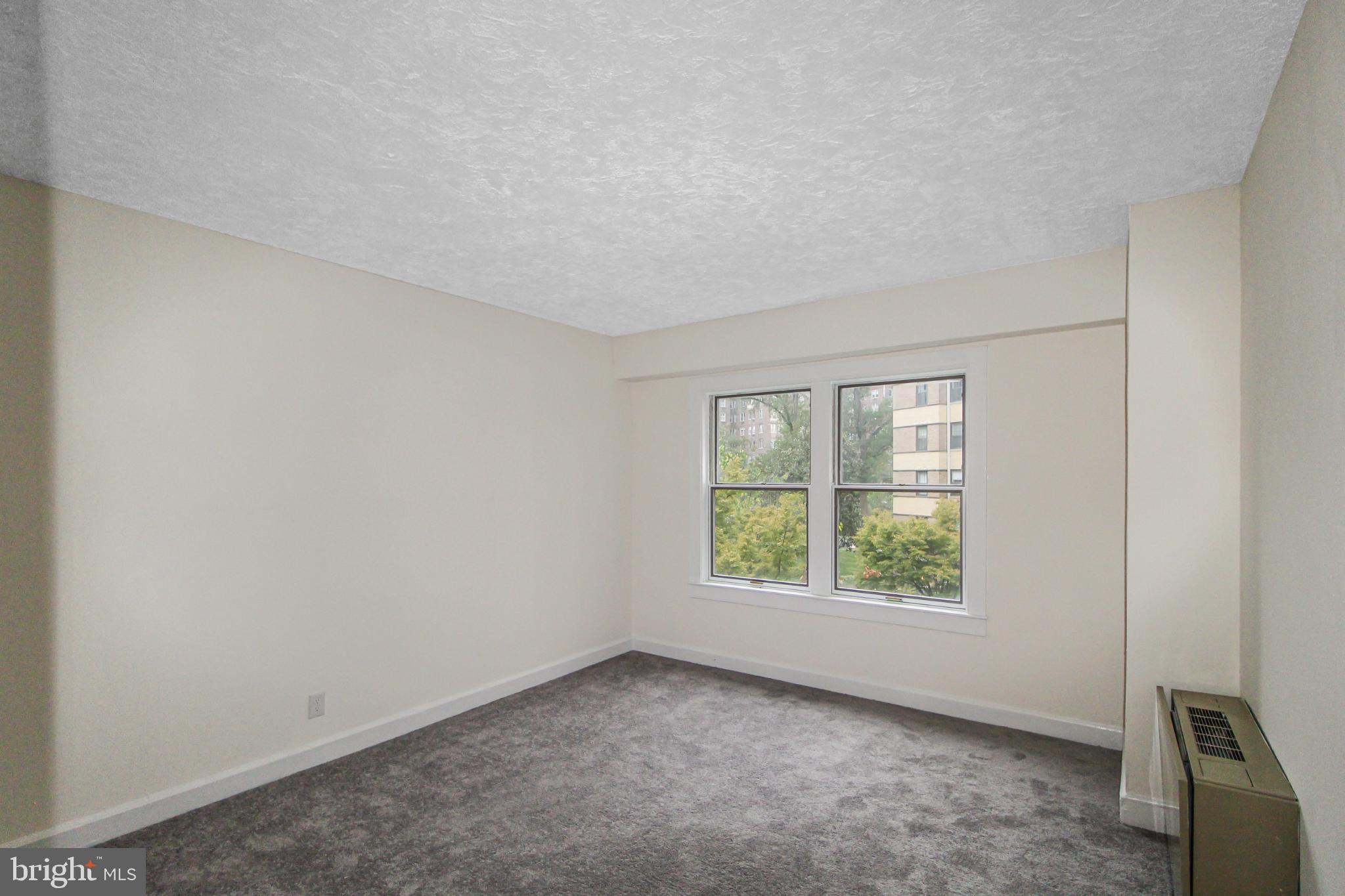3901 Cathedral Avenue Northwest, Unit 201 Washington, DC 20016 - Photo 20 of 30 Bedroom with natural light.