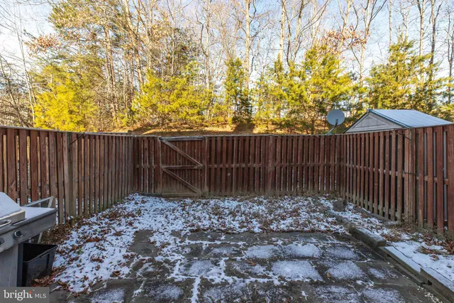a garden view with wooden fence