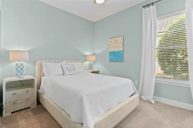 a view of a dining room with furniture a chandelier and wooden floor