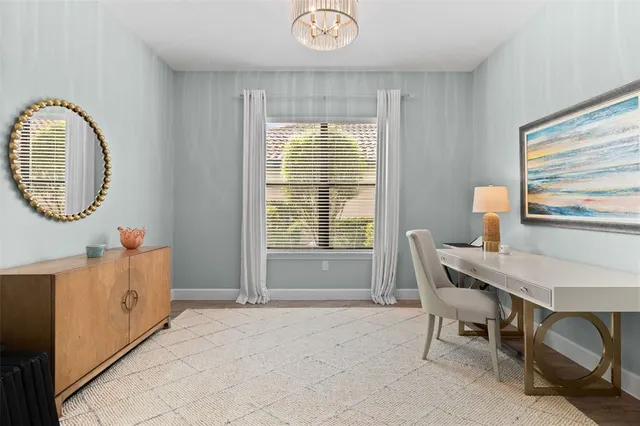 a large kitchen with kitchen island a sink table and chairs