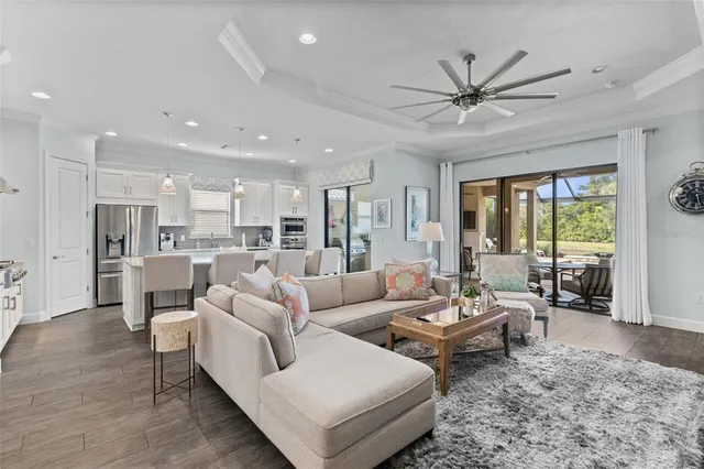 a spacious bedroom with a bed and a dresser