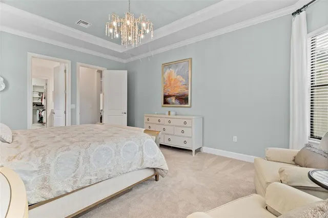 a living room with furniture a fireplace and a large window