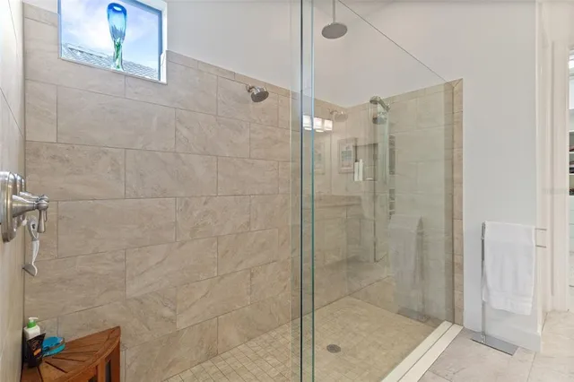 a view of a patio with a table and chairs under an umbrella