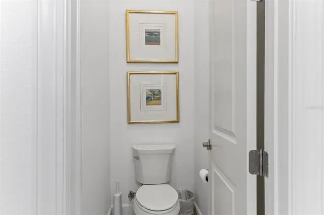 an aerial view of a house with a garden and lake view