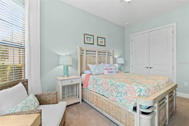 a bathroom with a granite countertop sink toilet and a mirror