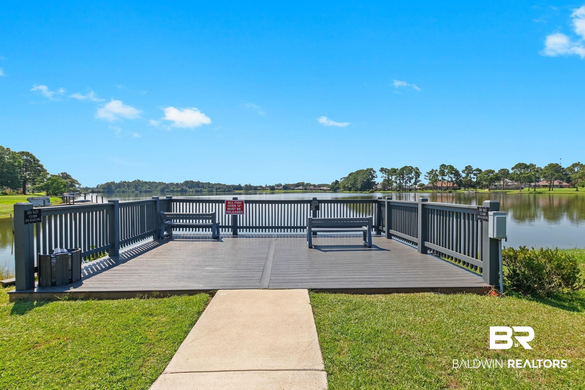 9815 Lakeview Drive Foley, AL 36535 - Photo 99 of 100 View of dock with a lawn and a deck with water view