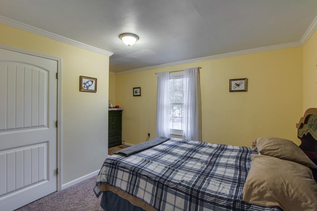 349 Buffalo Road Carthage, TN 37030 - Photo 25 of 30 a bedroom with a bed and a window