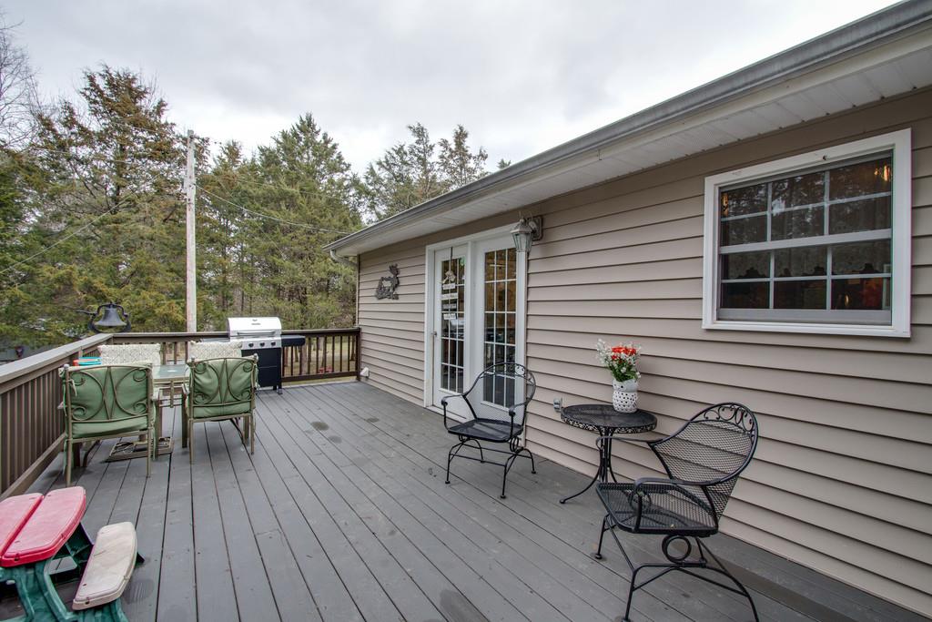 349 Buffalo Road Carthage, TN 37030 - Photo 6 of 30 a view of a patio with table and chairs with wooden floor and fence