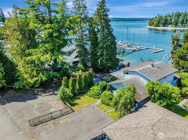 an aerial view of a house with a yard