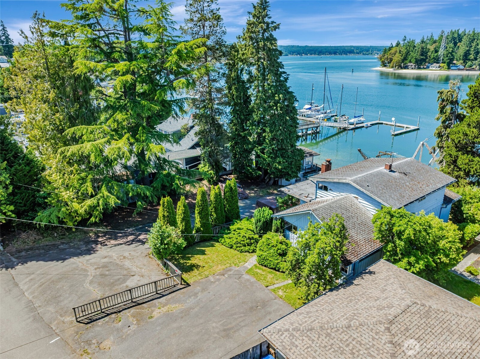 an aerial view of a house with a yard