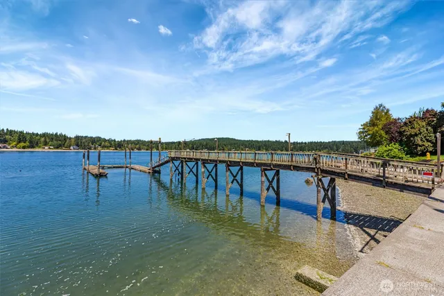 a view of a house with backyard porch and sitting area
