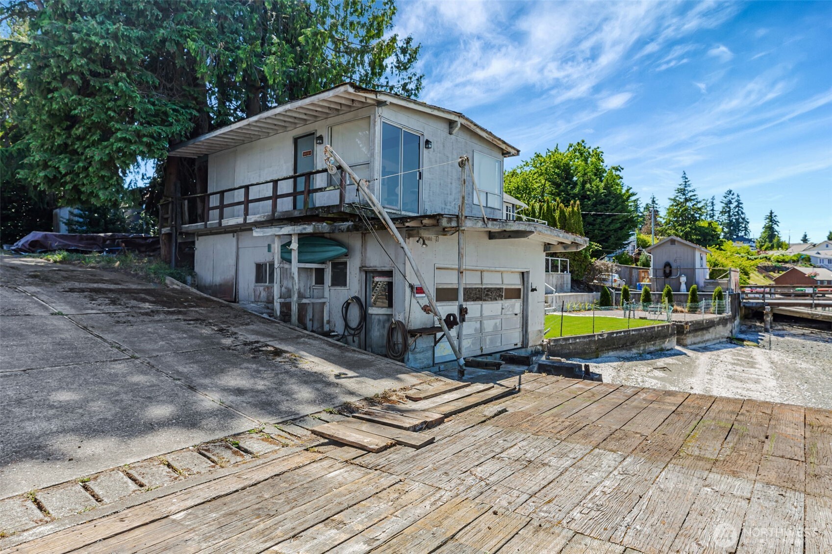 1954 Northeast Grandview Boulevard Keyport, WA 98345 - Photo 16 of 40 a view of a house with backyard and sitting area