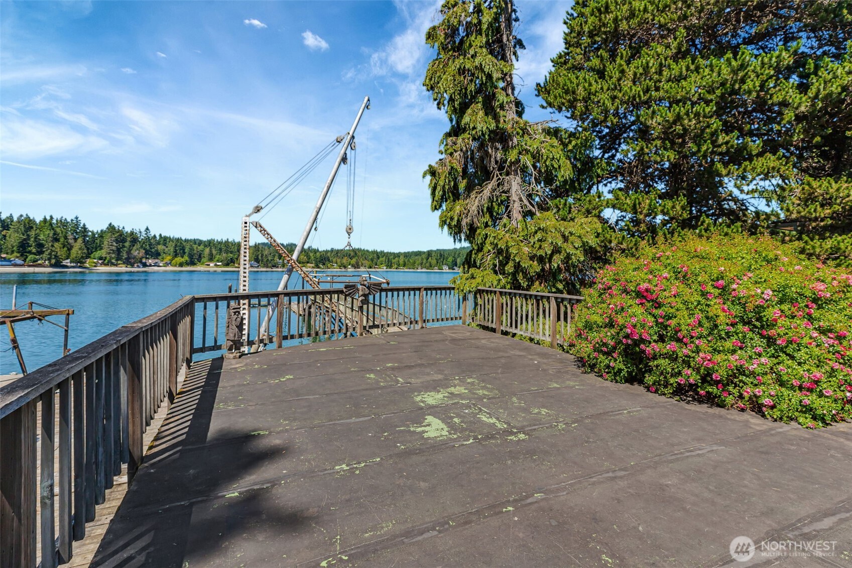 1954 Northeast Grandview Boulevard Keyport, WA 98345 - Photo 17 of 40 a view of a balcony next to a lake