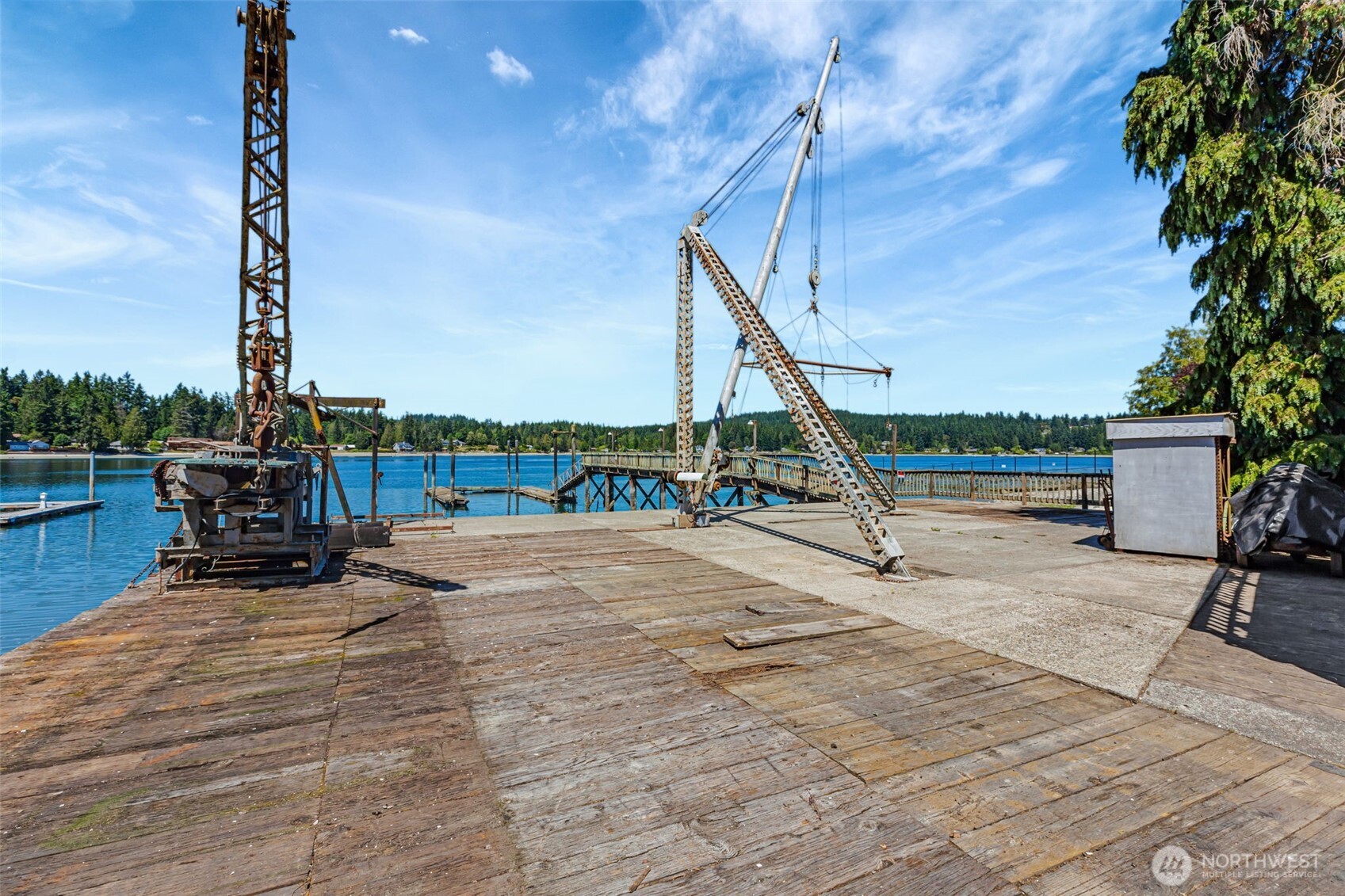 1954 Northeast Grandview Boulevard Keyport, WA 98345 - Photo 21 of 40 a view of a swimming pool with a chairs in the patio