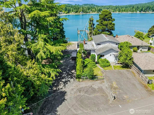 a view of a lake with a house in the background