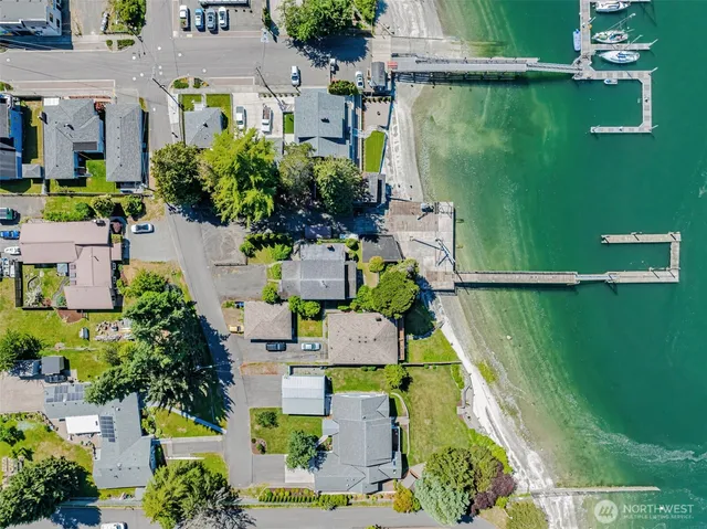 an aerial view of a house with swimming pool garden and outdoor seating