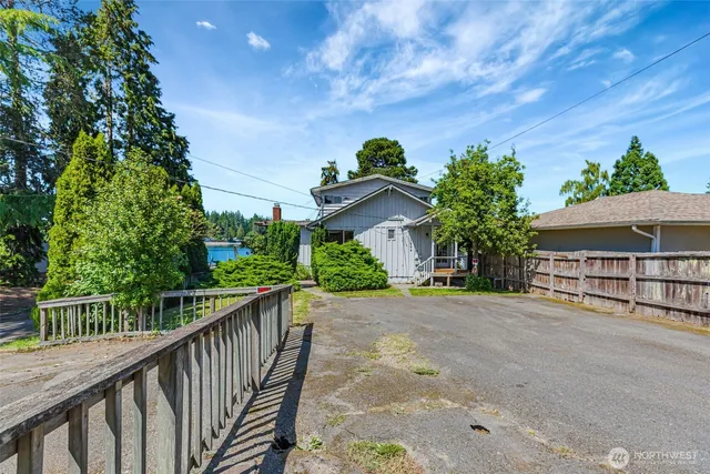 a view of a house with wooden fence