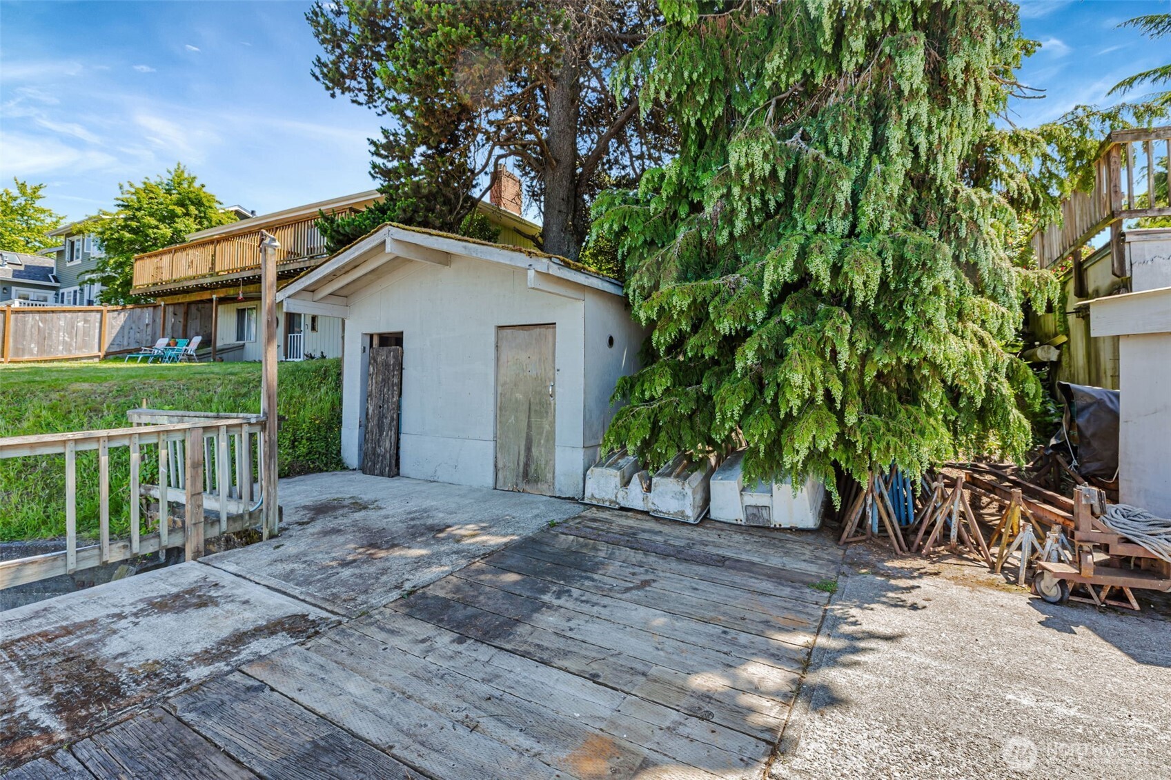 1954 Northeast Grandview Boulevard Keyport, WA 98345 - Photo 34 of 40 a view of a house with a yard and large trees
