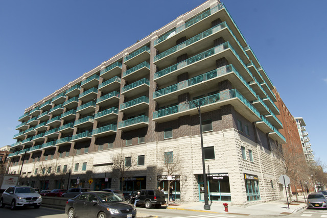 910 West Madison Street, Unit 609 Chicago, IL 60607 - Photo 1 of 12 a view of a building with a street