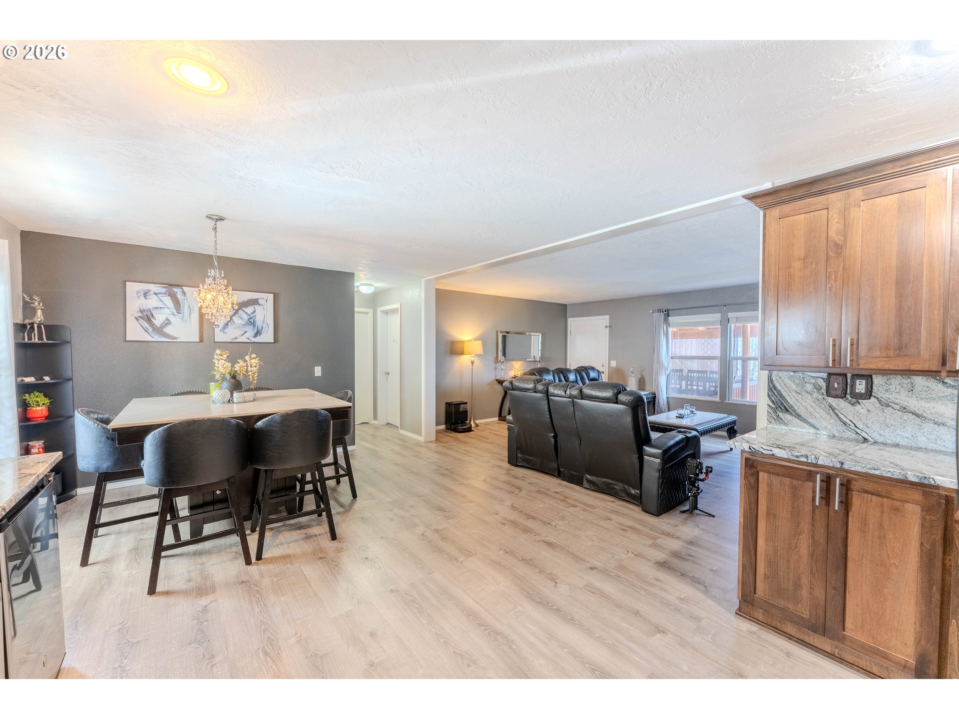 4364 Bren Loop Northeast, Unit 95 Salem, OR 97305 - Photo 11 of 34 a living room with furniture a dining table and a window with wooden floor