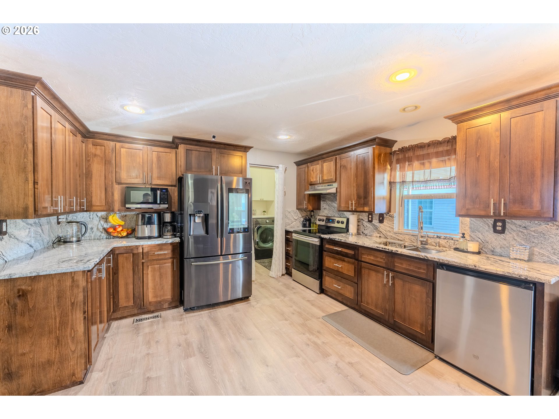 4364 Bren Loop Northeast, Unit 95 Salem, OR 97305 - Photo 14 of 34 a kitchen with refrigerator and cabinets