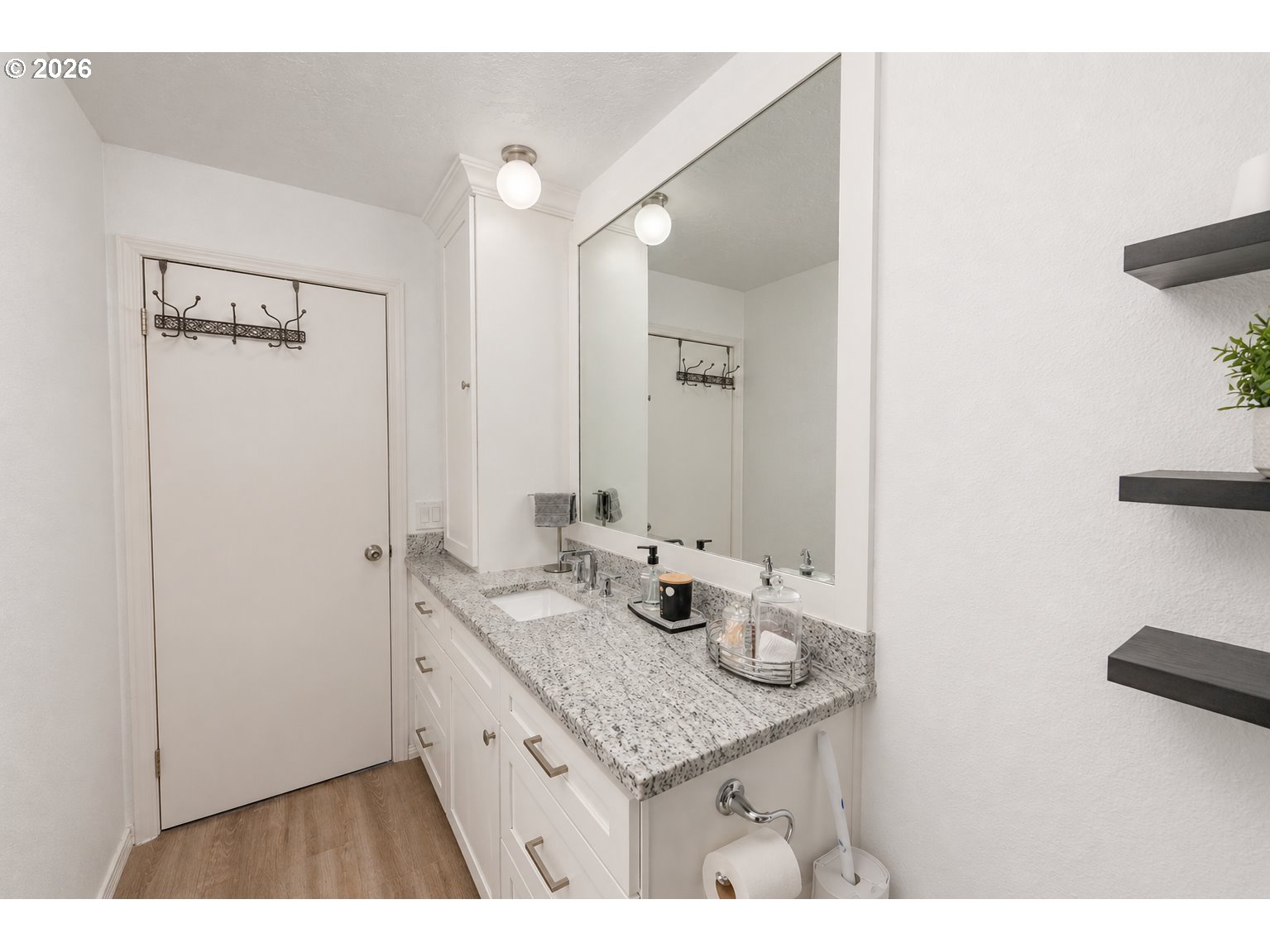 4364 Bren Loop Northeast, Unit 95 Salem, OR 97305 - Photo 16 of 34 a bathroom with a granite countertop sink a mirror and a shower