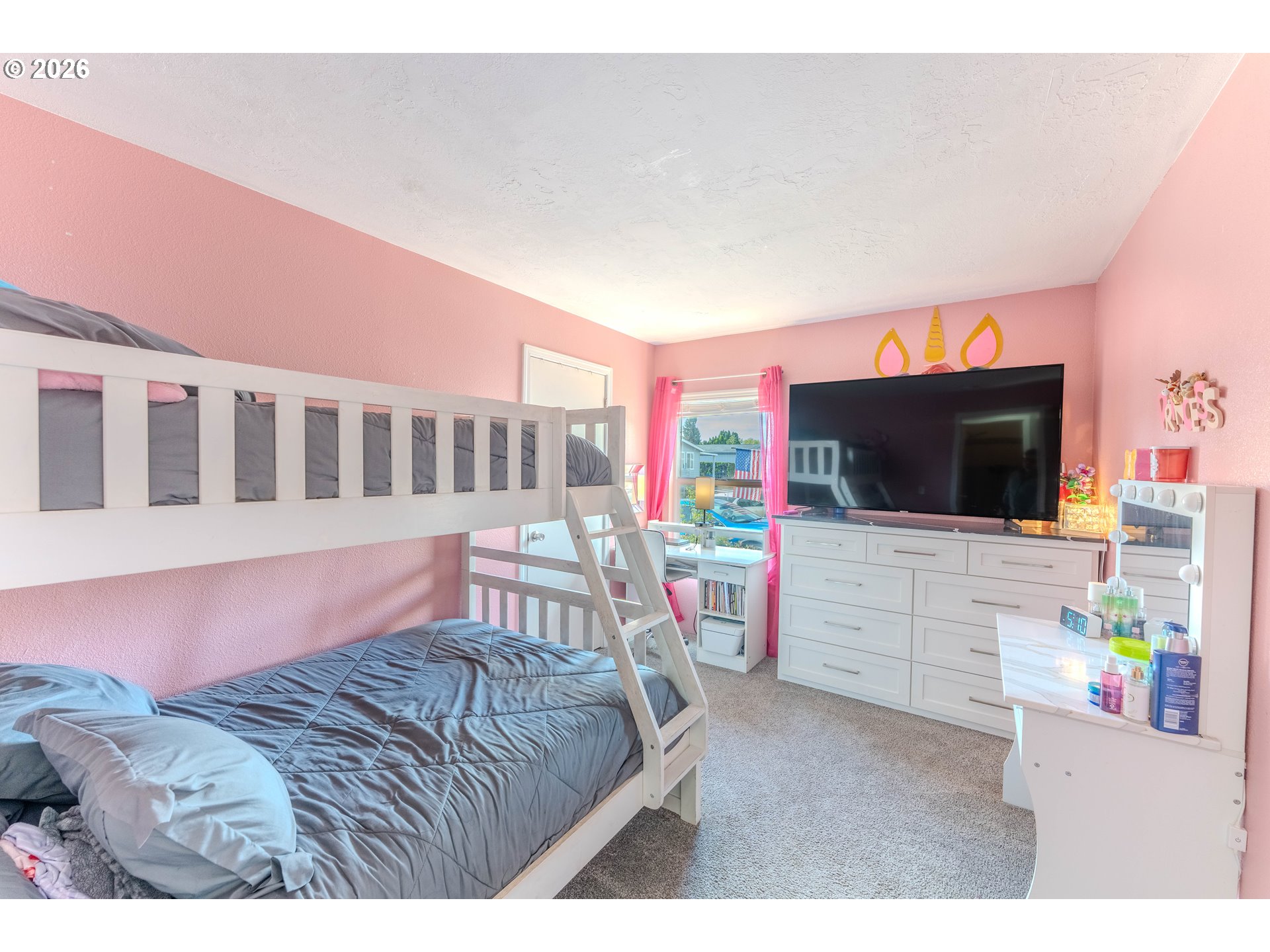 4364 Bren Loop Northeast, Unit 95 Salem, OR 97305 - Photo 19 of 34 a bedroom with furniture and a flat screen tv
