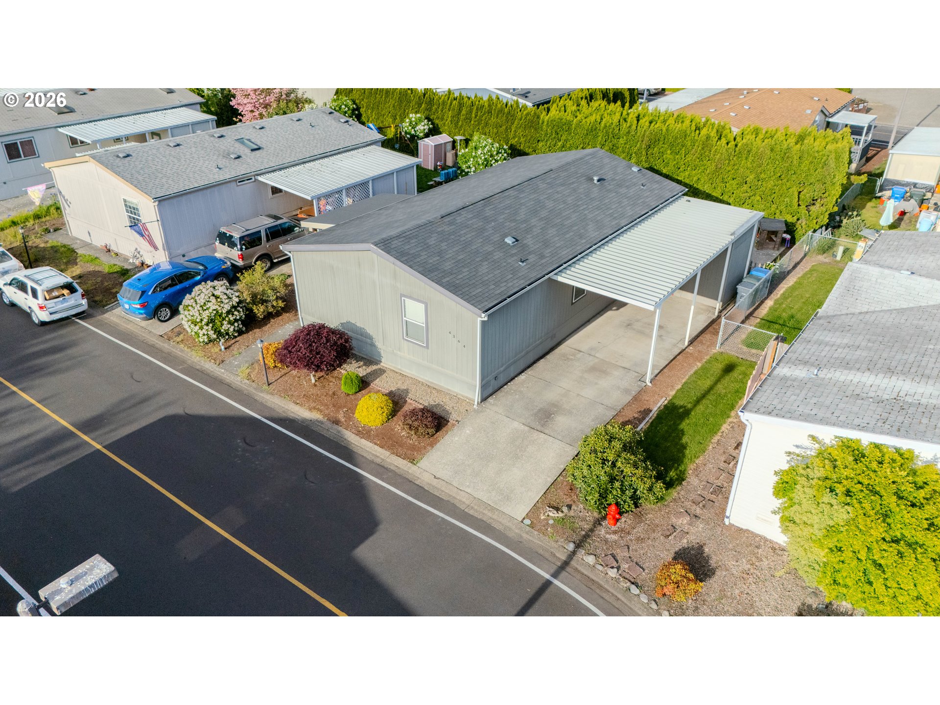 4364 Bren Loop Northeast, Unit 95 Salem, OR 97305 - Photo 2 of 34 a picture of city view with lots of potted plants