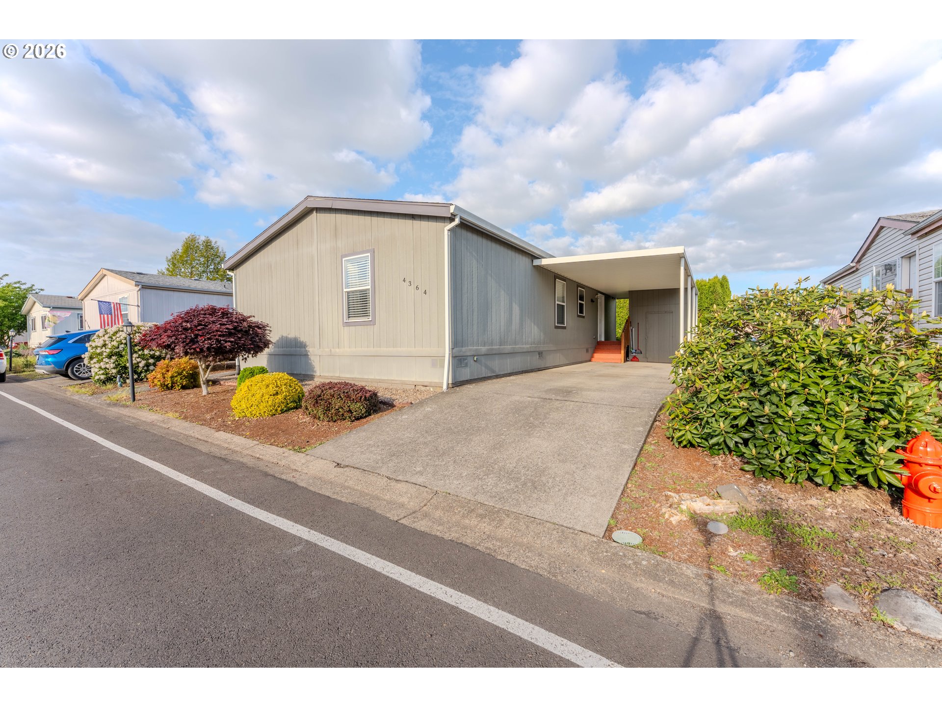 4364 Bren Loop Northeast, Unit 95 Salem, OR 97305 - Photo 4 of 34 a house view with a garden space