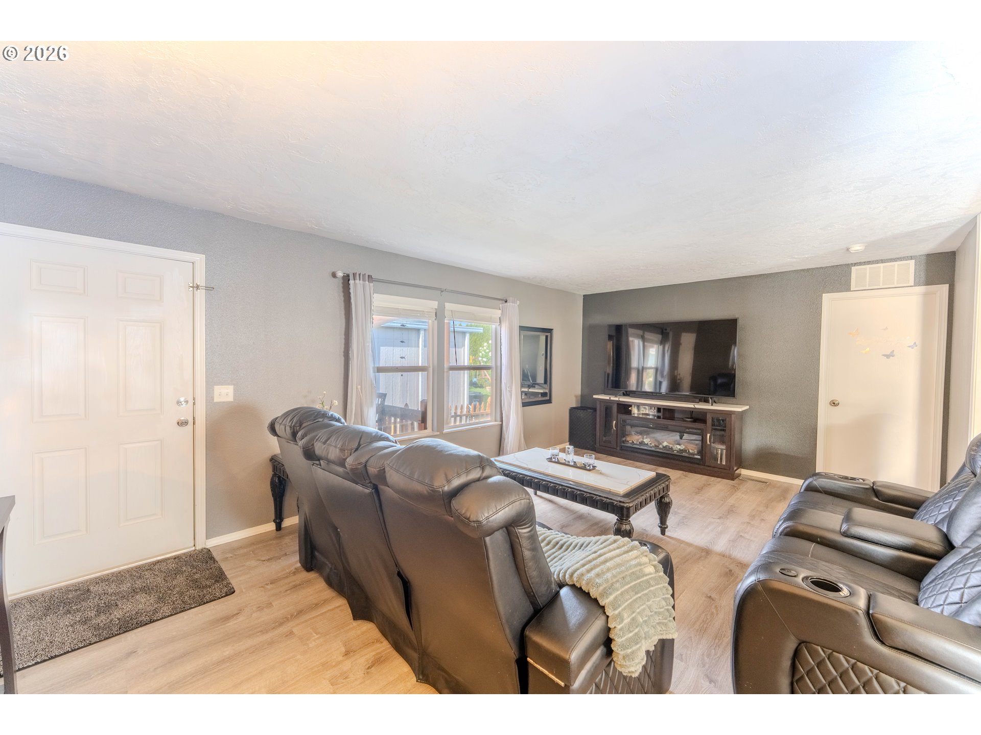 4364 Bren Loop Northeast, Unit 95 Salem, OR 97305 - Photo 7 of 34 a living room with furniture and a flat screen tv