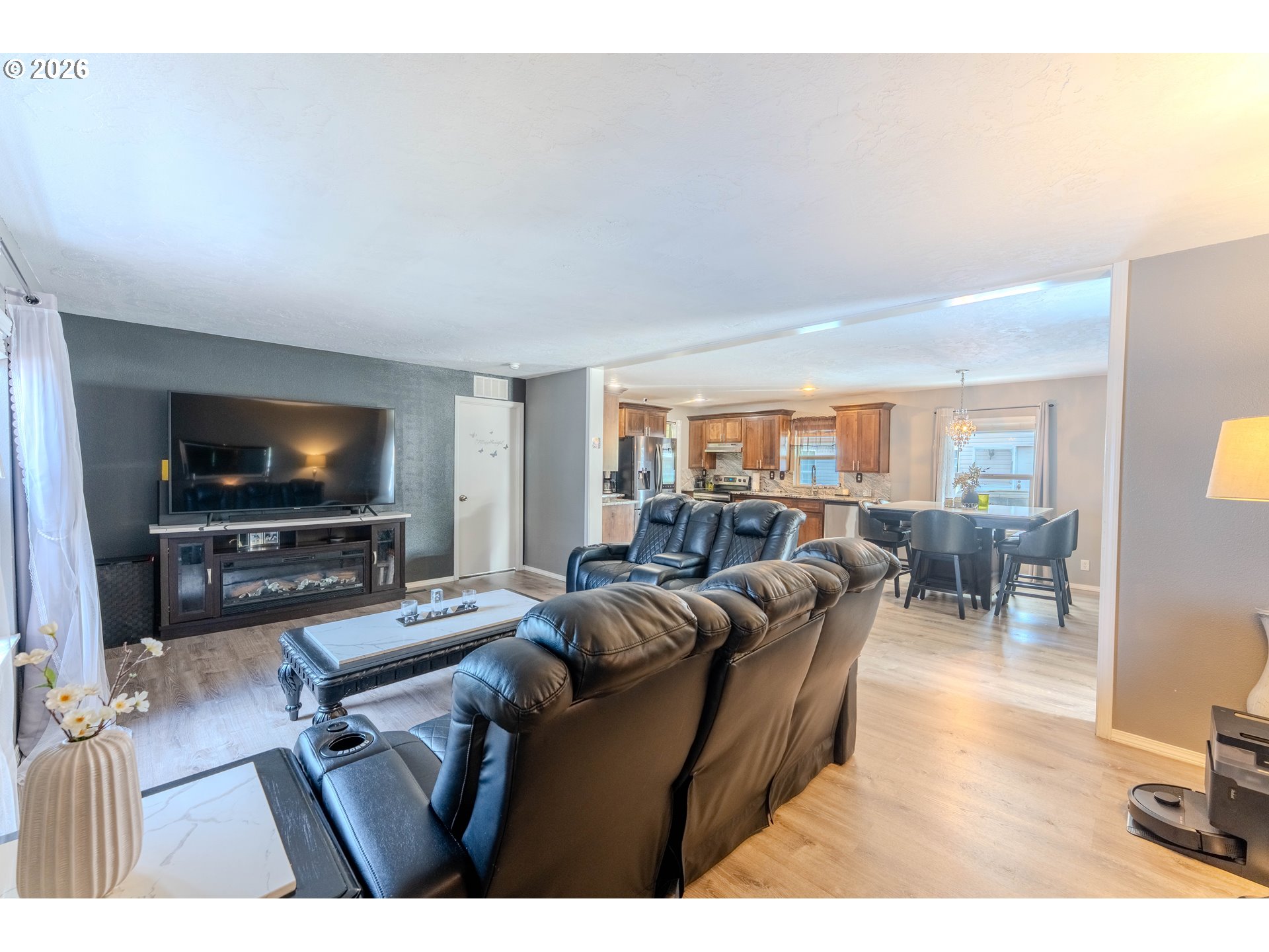 4364 Bren Loop Northeast, Unit 95 Salem, OR 97305 - Photo 10 of 34 a living room with furniture and a flat screen tv