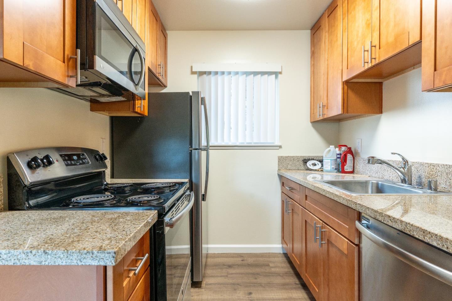 Higgins Way Pacifica, CA 94044 - Photo 3 of 10 a kitchen with stainless steel appliances granite countertop a sink stove and refrigerator