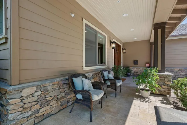 a living room with fireplace furniture and a flat screen tv