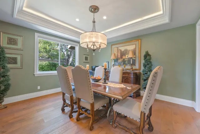 a bedroom with a bed and a ceiling fan