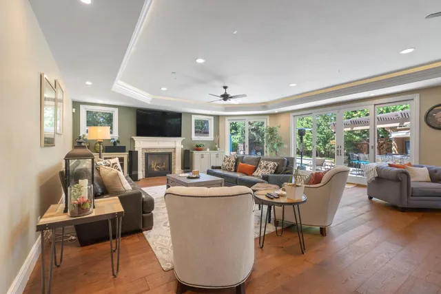 a bathroom with a tub a sink and a large mirror
