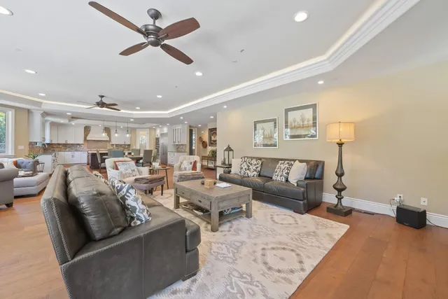 a spacious bathroom with a granite countertop sink mirror and a toilet