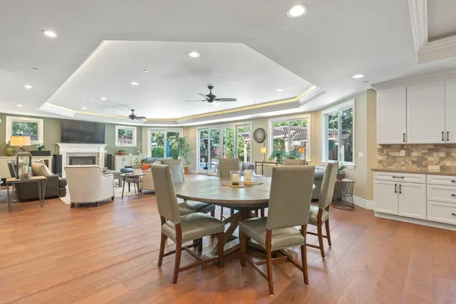 a bedroom with a bed and a ceiling fan
